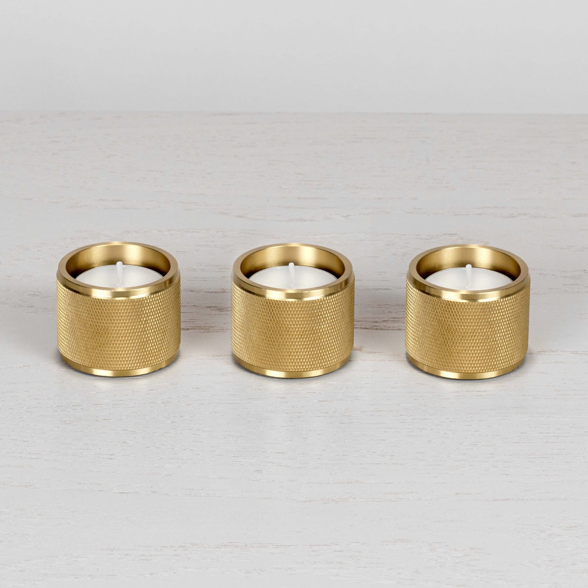 1.-BusterPunch_Tealight_Candle_Holders_Set-of-3_Brass_Front_off-1-scaled.jpg