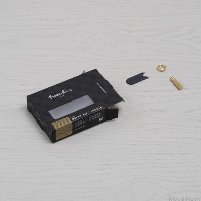 Dekorativt kit för strömbrytare i bränd brons i mässingsdetaljer