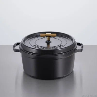 Staub Cocotte-gryta 6,7 l svart stål med räfflat mässingshandtag